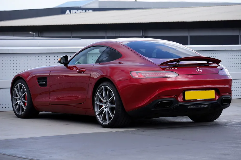Red Mercedes-AMG GT with premium dark window tint