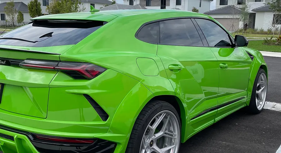 Lamborghini Urus wrapped in gloss green vinyl by Tasha Car Detailing in Miami
